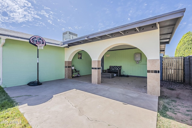 view of patio with a gate