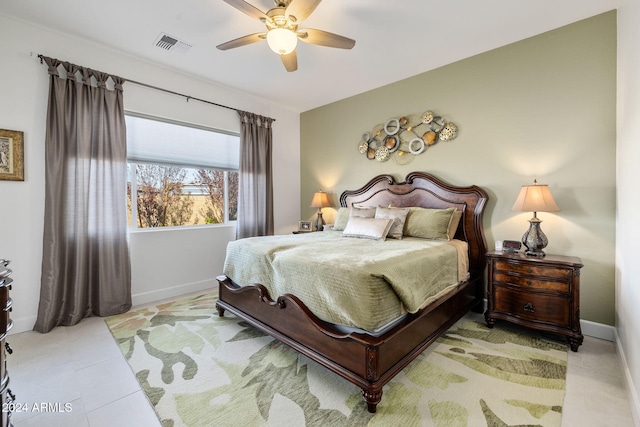 tiled bedroom featuring visible vents, baseboards, and ceiling fan