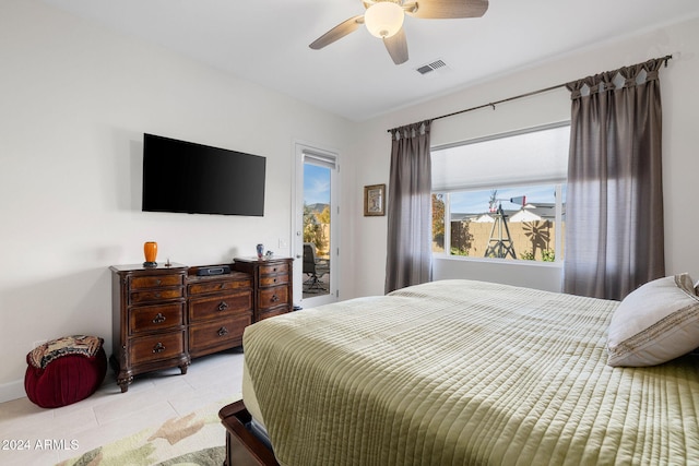 bedroom featuring light tile patterned floors, visible vents, access to outside, and a ceiling fan