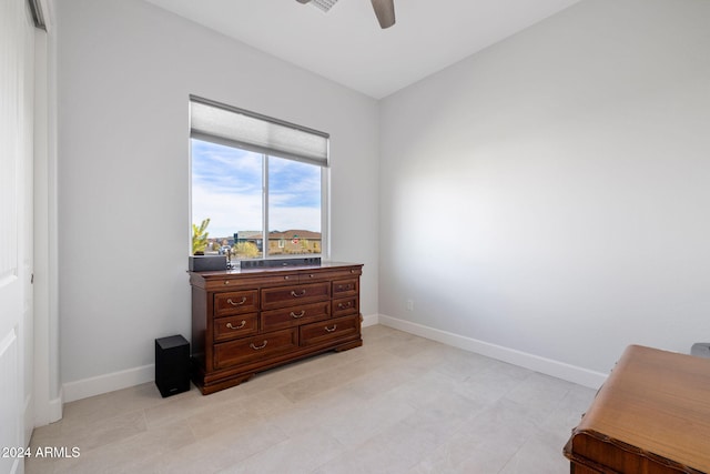 bedroom with ceiling fan, baseboards, and a closet