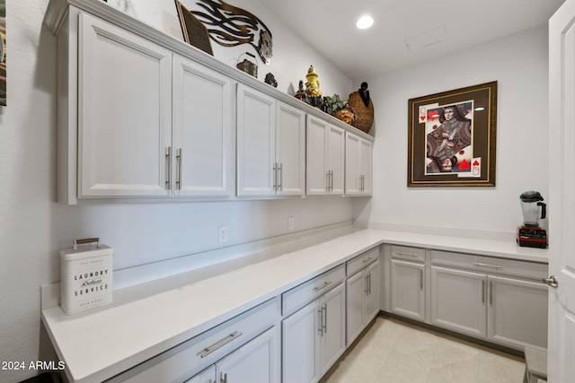 interior space featuring light countertops, recessed lighting, and light tile patterned flooring