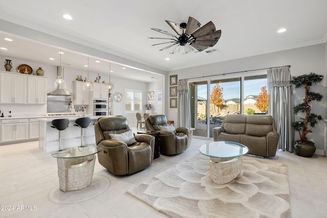 living room featuring crown molding, light tile patterned floors, ceiling fan, and recessed lighting