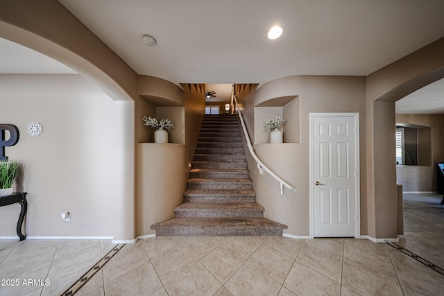 2886 E Hazeltine Way, Chandler, AZ 85249 - stairs featuring arched walkways, baseboards, and tile patterned flooring
