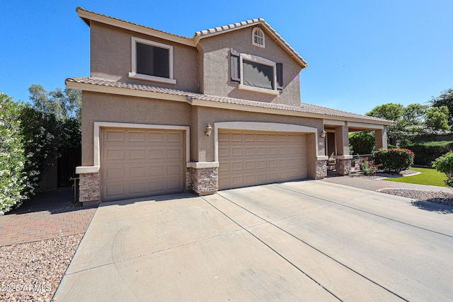 2886 E Hazeltine Way, Chandler, AZ 85249 - view of front of home with a tile roof, concrete driveway, an attached garage, stone siding, and stucco siding