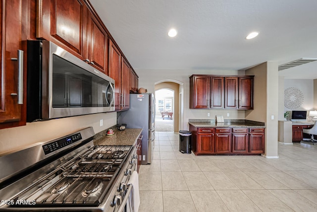 2886 E Hazeltine Way, Chandler, AZ 85249 - kitchen featuring visible vents, recessed lighting, arched walkways, light tile patterned floors, and stainless steel appliances