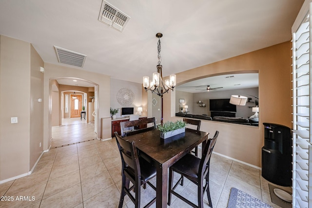 2886 E Hazeltine Way, Chandler, AZ 85249 - dining area with visible vents, arched walkways, ceiling fan with notable chandelier, and light tile patterned flooring