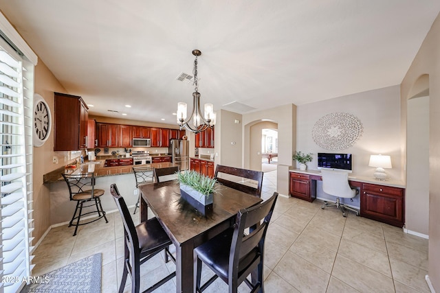 2886 E Hazeltine Way, Chandler, AZ 85249 - dining area featuring light tile patterned floors, arched walkways, recessed lighting, and visible vents