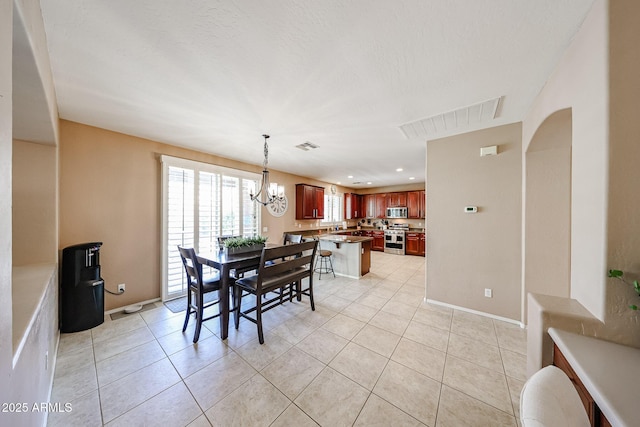 2886 E Hazeltine Way, Chandler, AZ 85249 - dining area with baseboards, a notable chandelier, visible vents, and light tile patterned floors