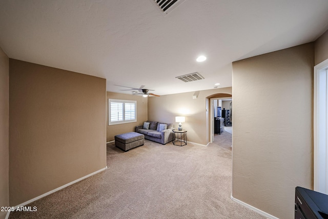 2886 E Hazeltine Way, Chandler, AZ 85249 - sitting room with ceiling fan, carpet floors, arched walkways, baseboards, and visible vents
