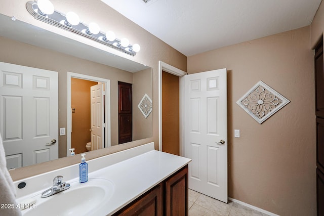 2886 E Hazeltine Way, Chandler, AZ 85249 - bathroom with toilet, baseboards, tile patterned flooring, and vanity