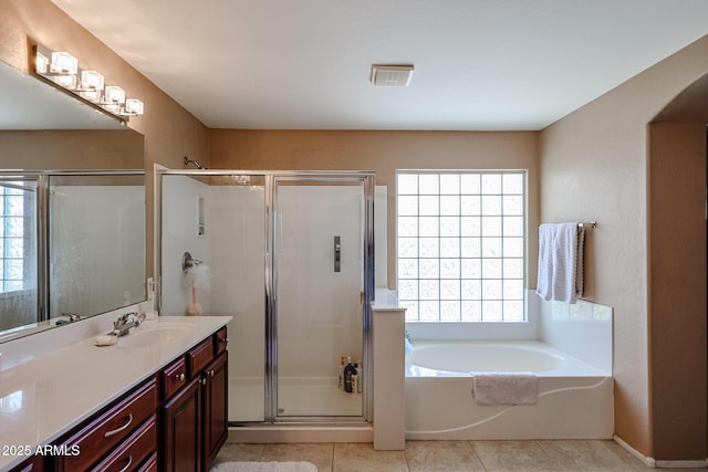 2886 E Hazeltine Way, Chandler, AZ 85249 - bathroom featuring vanity, tile patterned floors, a shower stall, visible vents, and a garden tub