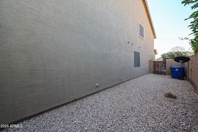 2886 E Hazeltine Way, Chandler, AZ 85249 - view of home's exterior with fence, a gate, and stucco siding