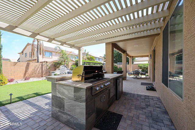 2886 E Hazeltine Way, Chandler, AZ 85249 - view of patio featuring area for grilling, outdoor dining area, exterior kitchen, a fenced backyard, and a pergola