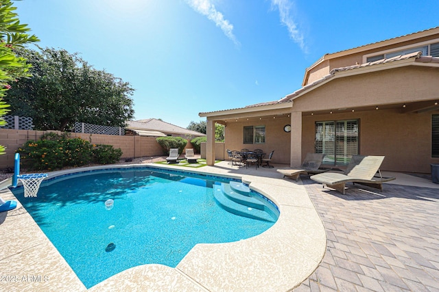 2886 E Hazeltine Way, Chandler, AZ 85249 - view of swimming pool with a fenced backyard, a fenced in pool, outdoor dining area, and a patio