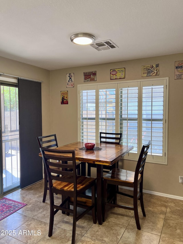 6049 S Wilson Dr, Chandler, AZ 85249 - dining area featuring light tile patterned flooring