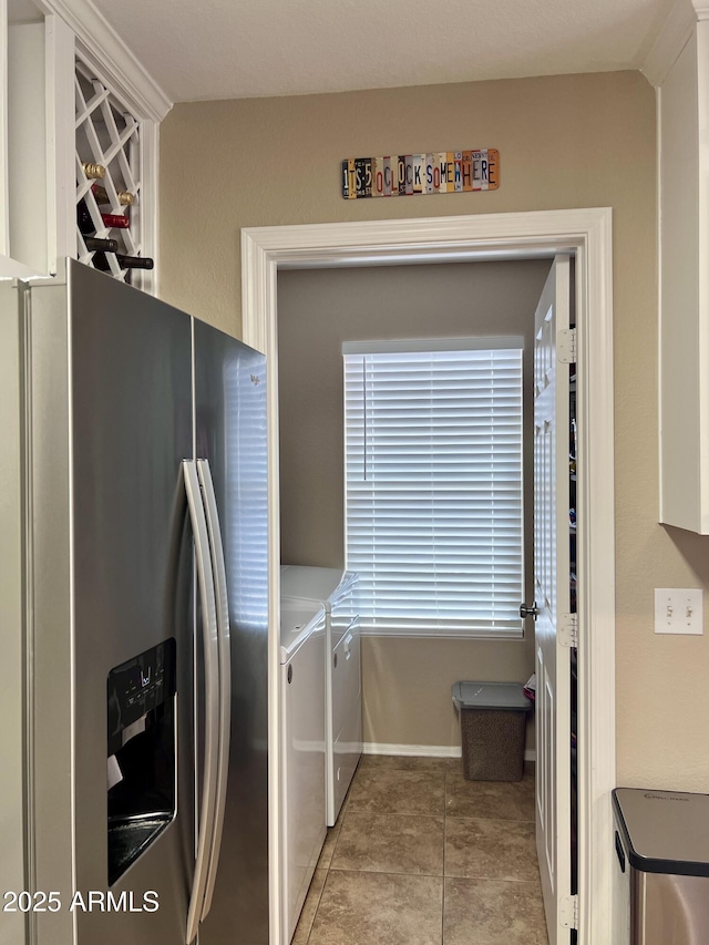 6049 S Wilson Dr, Chandler, AZ 85249 - kitchen featuring stainless steel fridge with ice dispenser, separate washer and dryer, light tile patterned floors, and baseboards