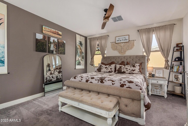 bedroom featuring ceiling fan, carpet flooring, and multiple windows