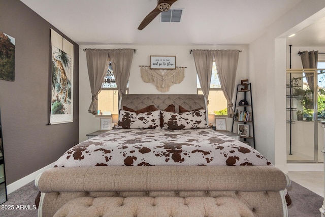 bedroom featuring ceiling fan, carpet, and multiple windows