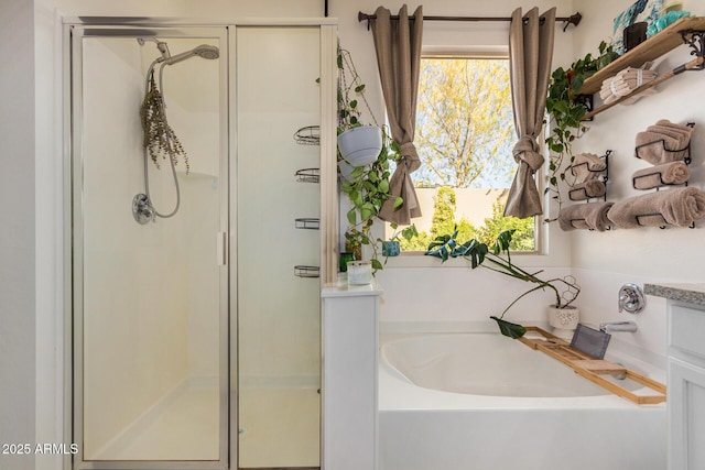 bathroom with independent shower and bath and a wealth of natural light