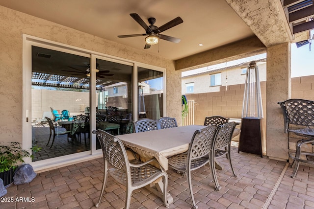 view of patio featuring ceiling fan