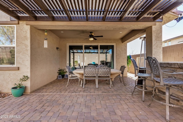 view of patio / terrace with ceiling fan and a pergola