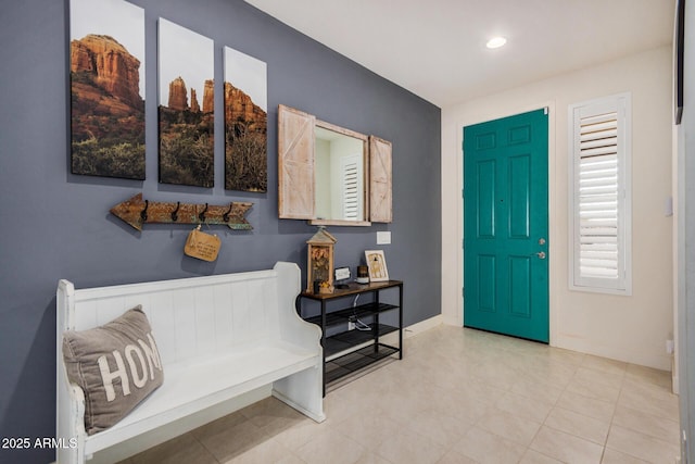 entryway featuring light tile patterned floors