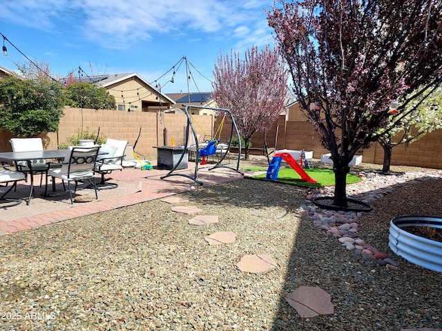 exterior space with a patio and a fenced backyard