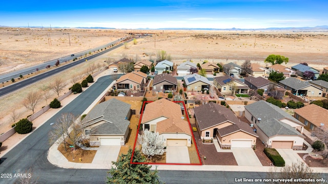 birds eye view of property with a residential view