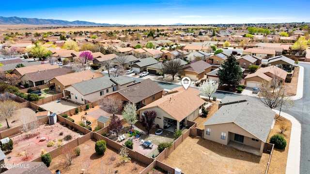 birds eye view of property featuring a mountain view and a residential view