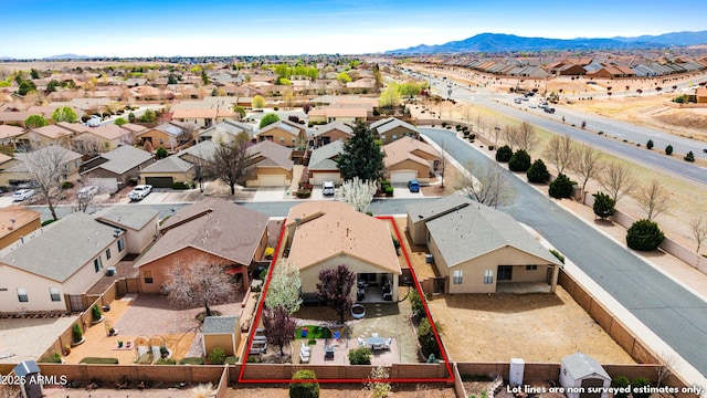 drone / aerial view featuring a mountain view and a residential view