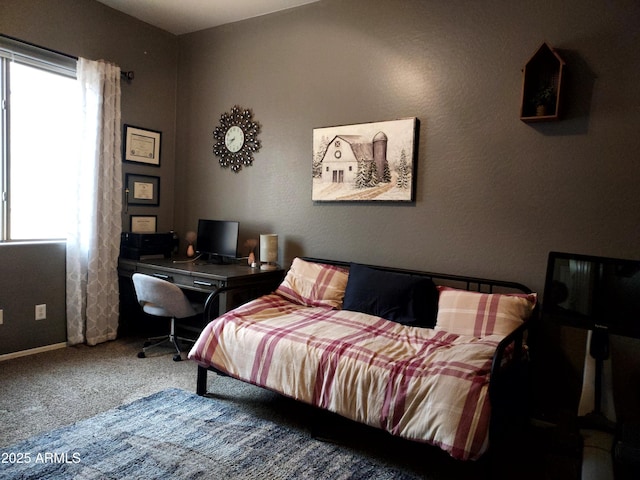 bedroom featuring carpet flooring and baseboards