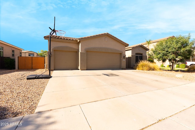4064 E Reins Rd, Gilbert, AZ 85297 - mediterranean / spanish-style home featuring an attached garage, stucco siding, driveway, and a tile roof