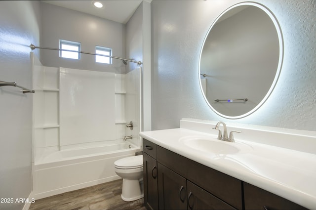 18175 W Highland Ave, Goodyear, AZ 85395 - bathroom with shower / bath combination, wood finished floors, vanity, toilet, and a textured wall