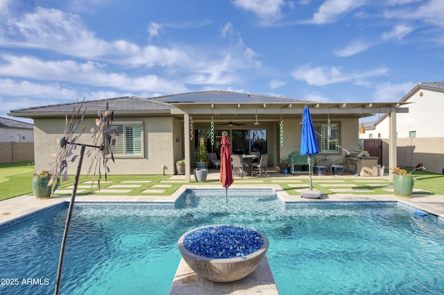 18175 W Highland Ave, Goodyear, AZ 85395 - back of house with fence, a ceiling fan, a patio area, and stucco siding