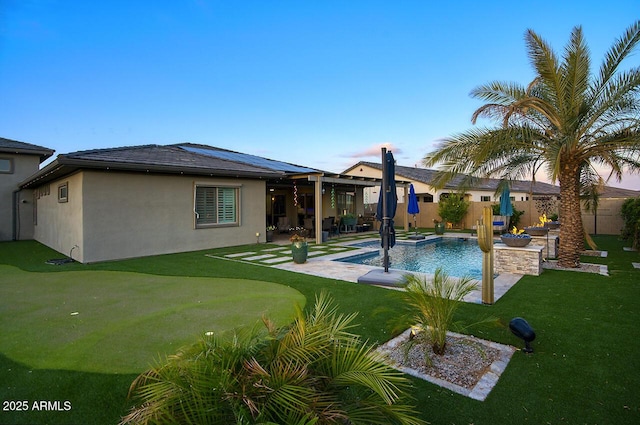 18175 W Highland Ave, Goodyear, AZ 85395 - view of swimming pool featuring a lawn, a fenced in pool, a fenced backyard, and a patio area