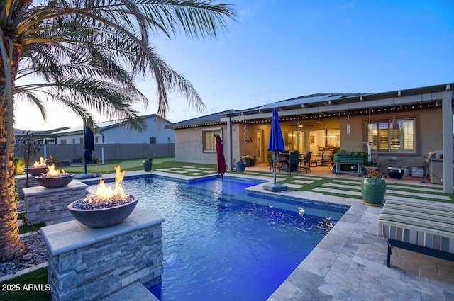 18175 W Highland Ave, Goodyear, AZ 85395 - view of pool featuring fence, an outdoor fire pit, a fenced in pool, a patio area, and a ceiling fan