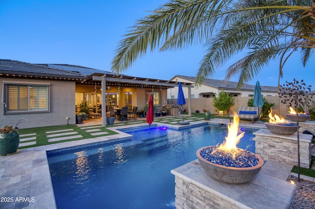 18175 W Highland Ave, Goodyear, AZ 85395 - view of pool with a fenced in pool, a fenced backyard, a patio area, and an outdoor fire pit