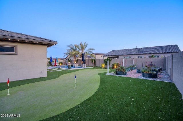 18175 W Highland Ave, Goodyear, AZ 85395 - view of yard with a fenced backyard, a fenced in pool, and a patio area