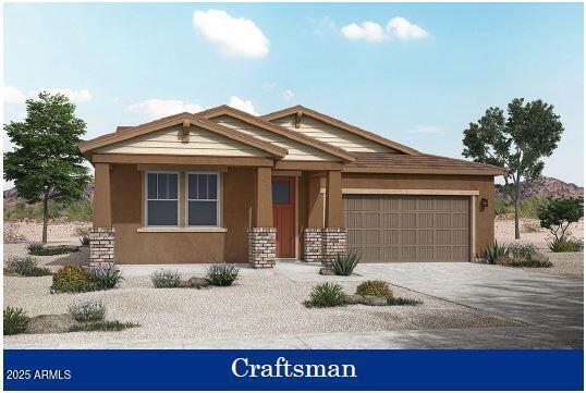 view of front of property featuring driveway, stucco siding, and an attached garage
