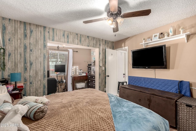 19258 N 20th Dr, Phoenix, AZ 85027 - bedroom featuring a ceiling fan, wallpapered walls, and a textured ceiling