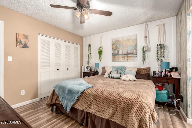 19258 N 20th Dr, Phoenix, AZ 85027 - bedroom with light wood finished floors, baseboards, a closet, and a textured ceiling