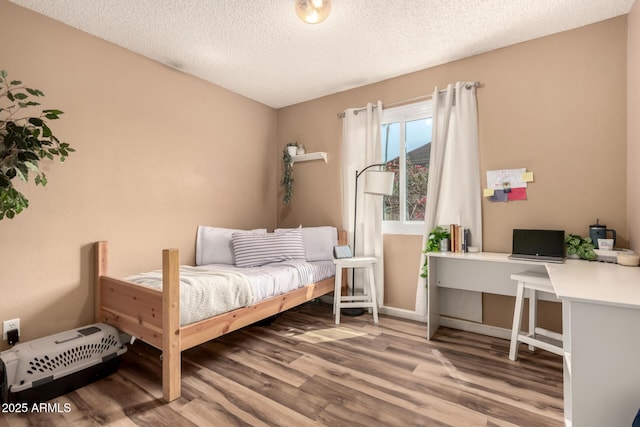 19258 N 20th Dr, Phoenix, AZ 85027 - bedroom featuring wood finished floors and a textured ceiling
