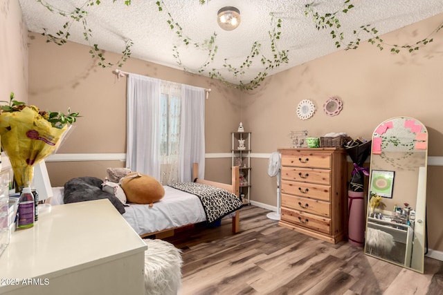 19258 N 20th Dr, Phoenix, AZ 85027 - bedroom with a textured ceiling, baseboards, and wood finished floors
