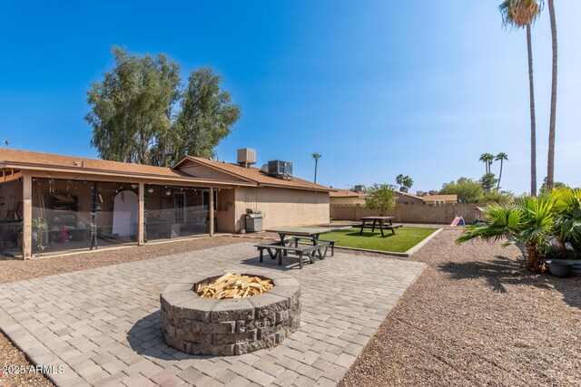 19258 N 20th Dr, Phoenix, AZ 85027 - back of house with a patio, a fire pit, central AC, and fence