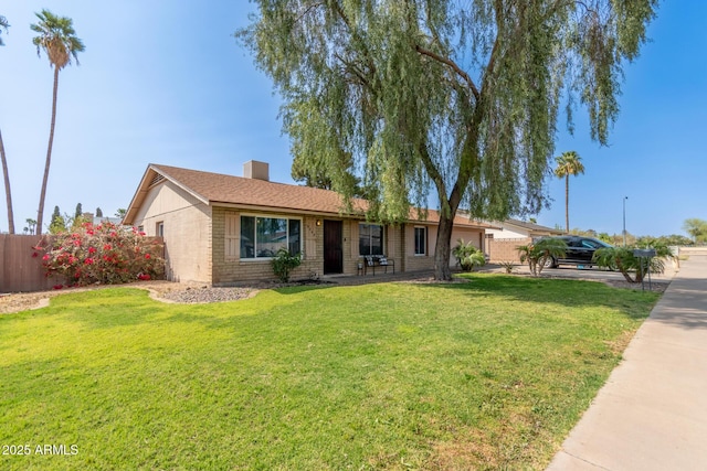 19258 N 20th Dr, Phoenix, AZ 85027 - ranch-style home featuring a front lawn, a chimney, fence, and brick siding