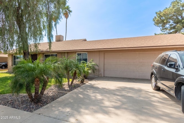 19258 N 20th Dr, Phoenix, AZ 85027 - ranch-style home featuring a chimney, a garage, and concrete driveway