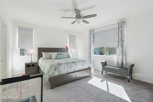 carpeted bedroom with a ceiling fan and baseboards