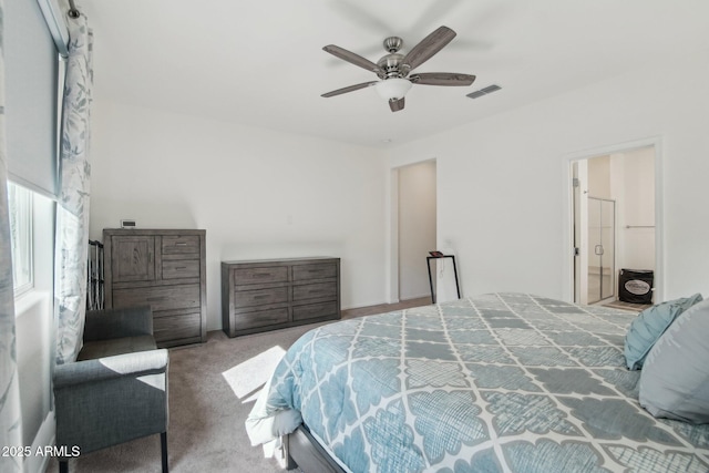 carpeted bedroom with visible vents and a ceiling fan