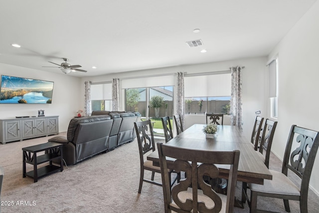 dining space with recessed lighting, light colored carpet, a ceiling fan, baseboards, and visible vents