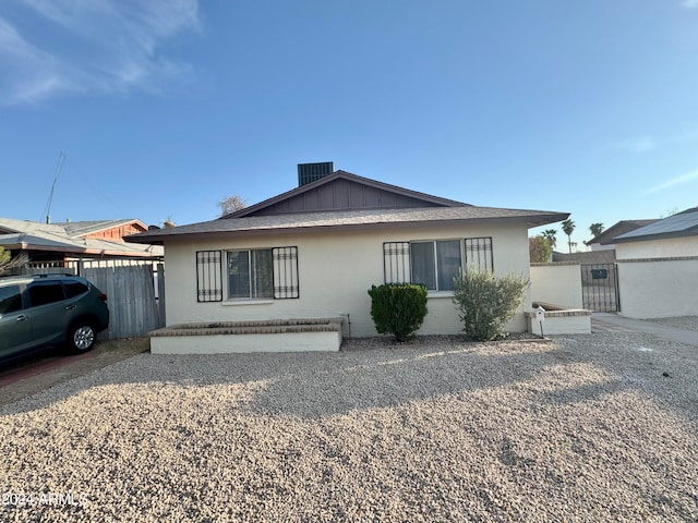 view of front of home with central AC and a carport